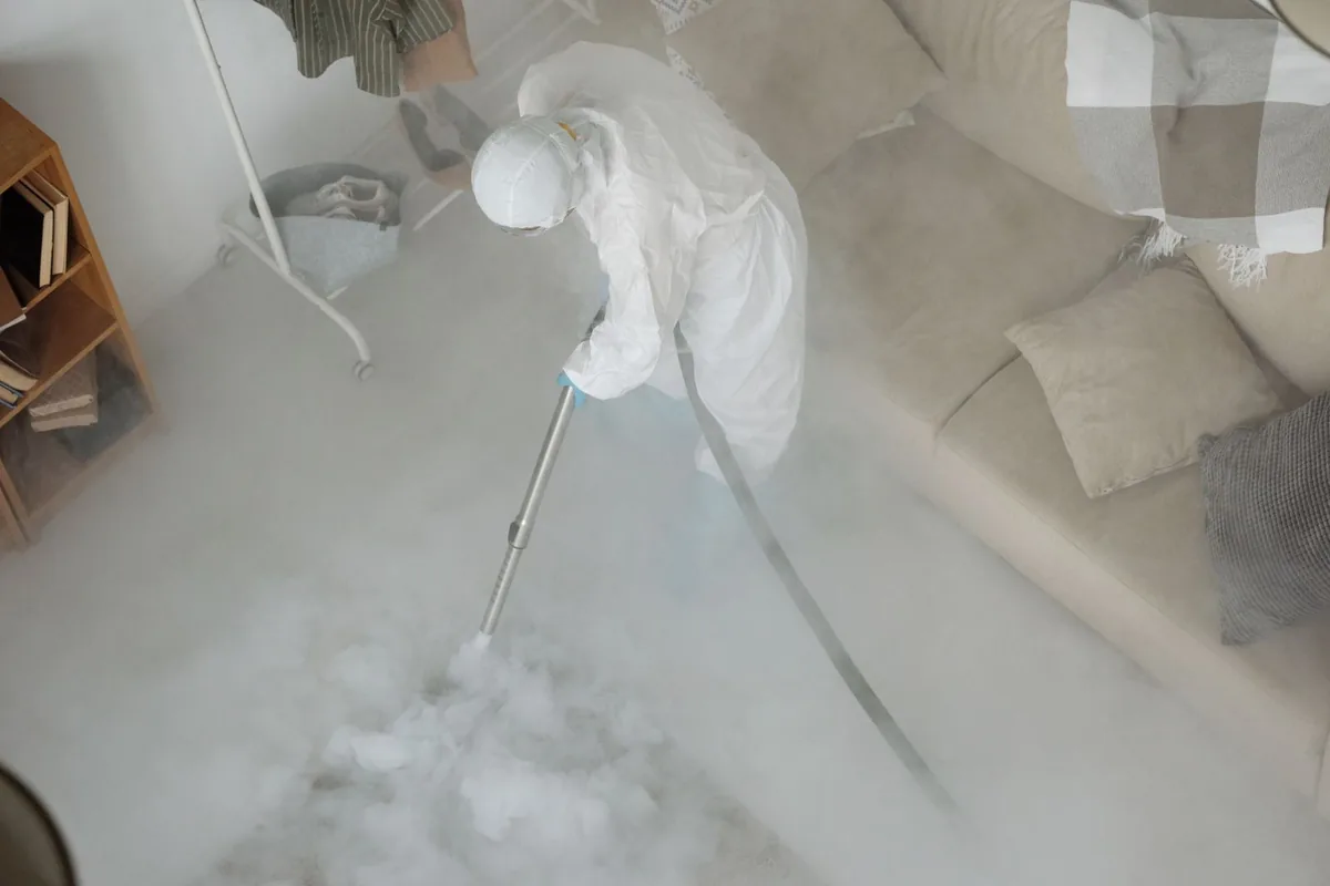 Biohazard cleanup technician in protective equipment, Huntsville, AL